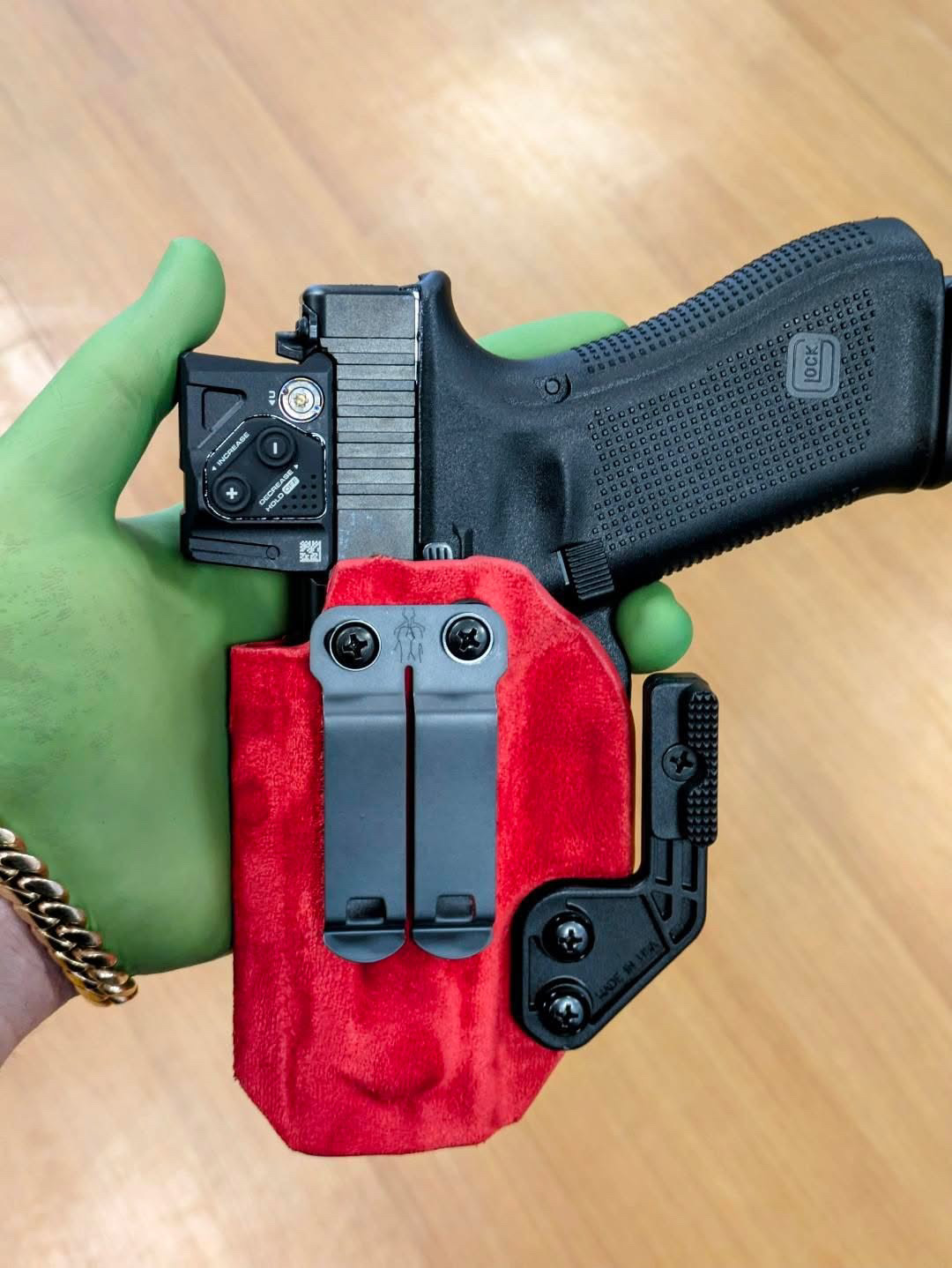Red suede-lined Kydex holster with Glock