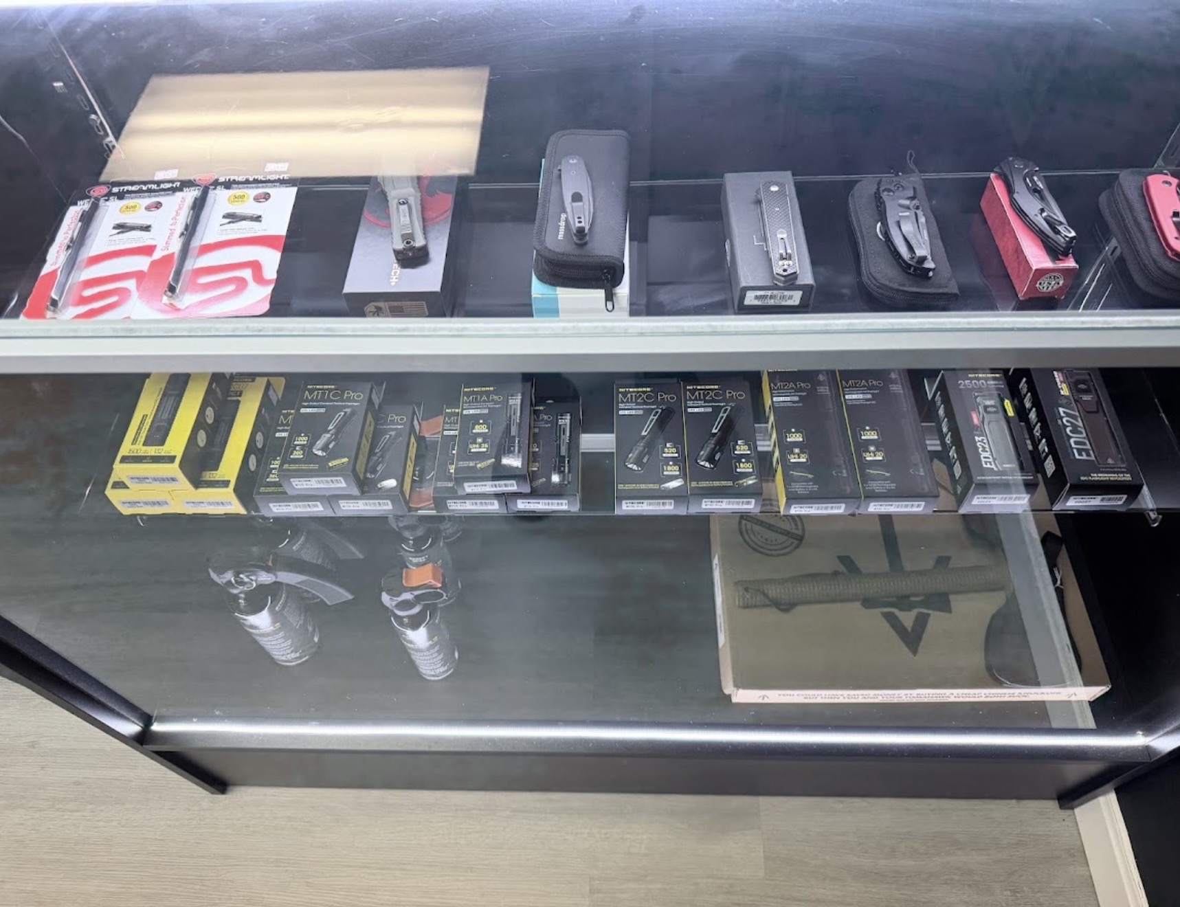 EDC display case with knives and flashlights
